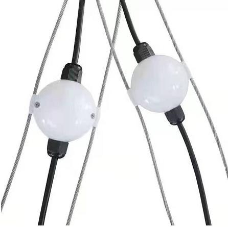 Two frosted pixel balls clipped onto a pair of steel support wires, black cable between them